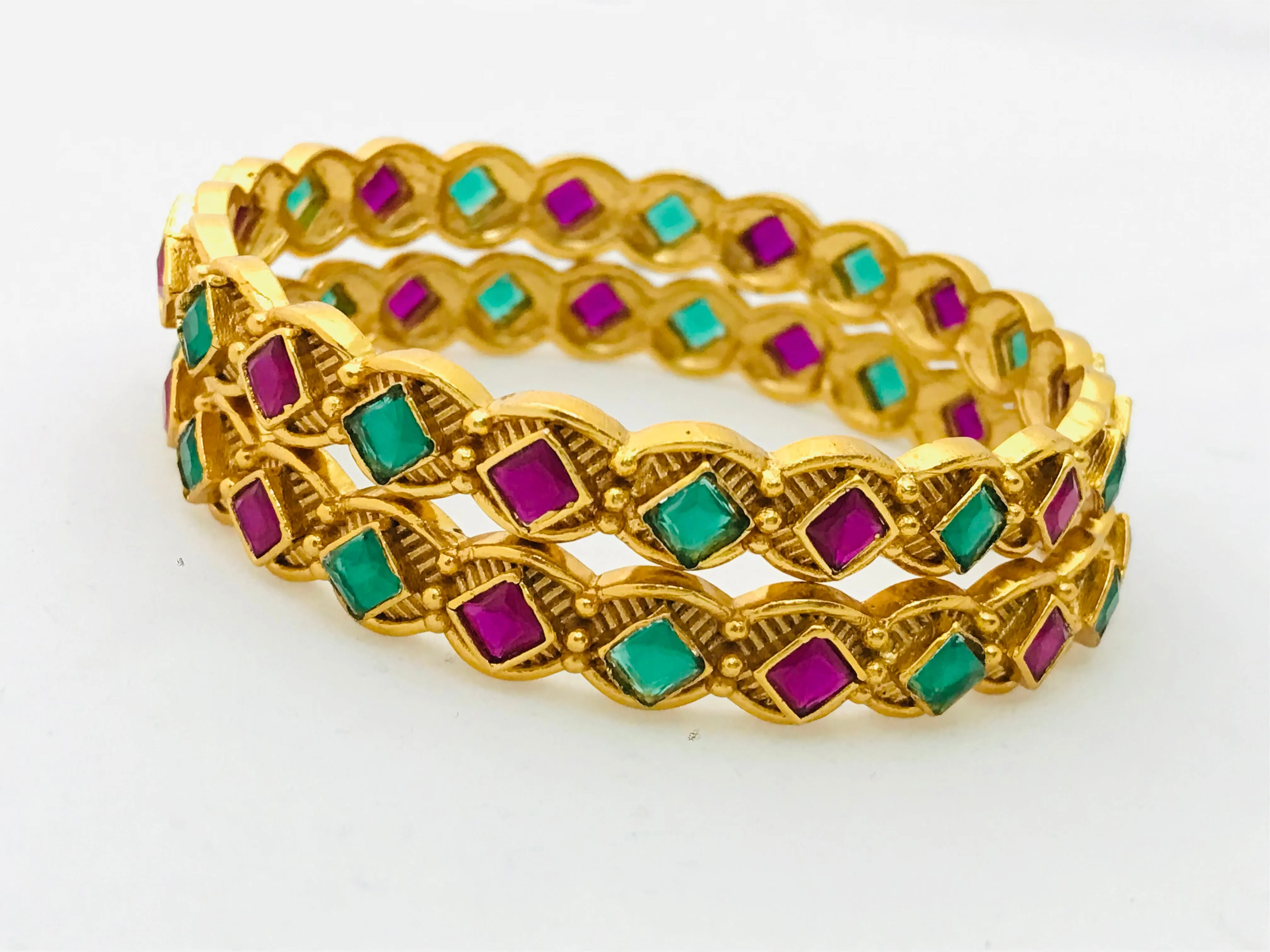 Beautiful Matte Finished Antique Gold Bangle Set With Emerald And Ruby Stones