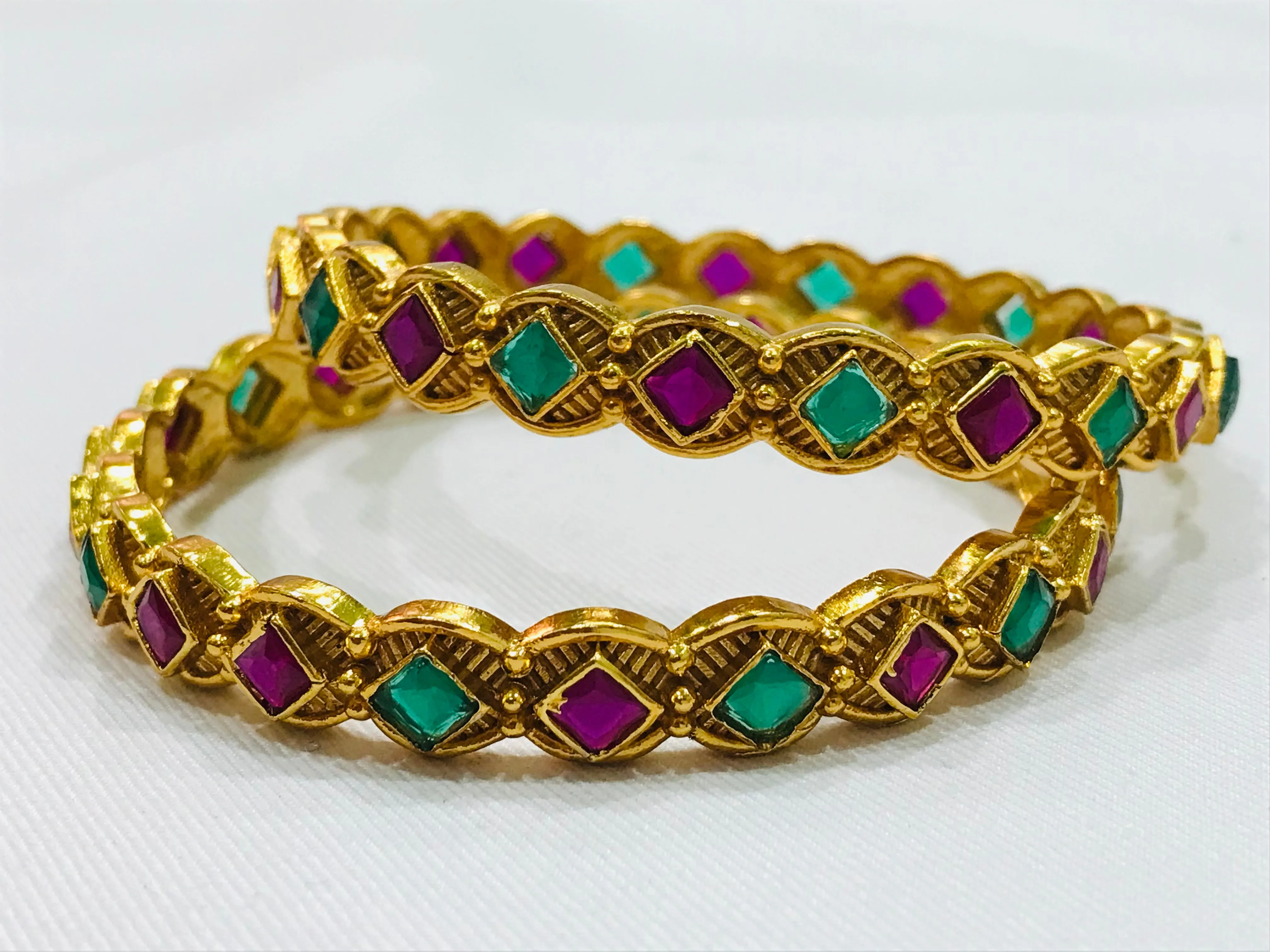 Beautiful Matte Finished Antique Gold Bangle Set With Emerald And Ruby Stones