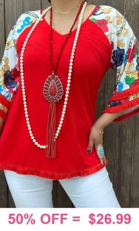 Red Top with white design bell sleeves and fringe trim